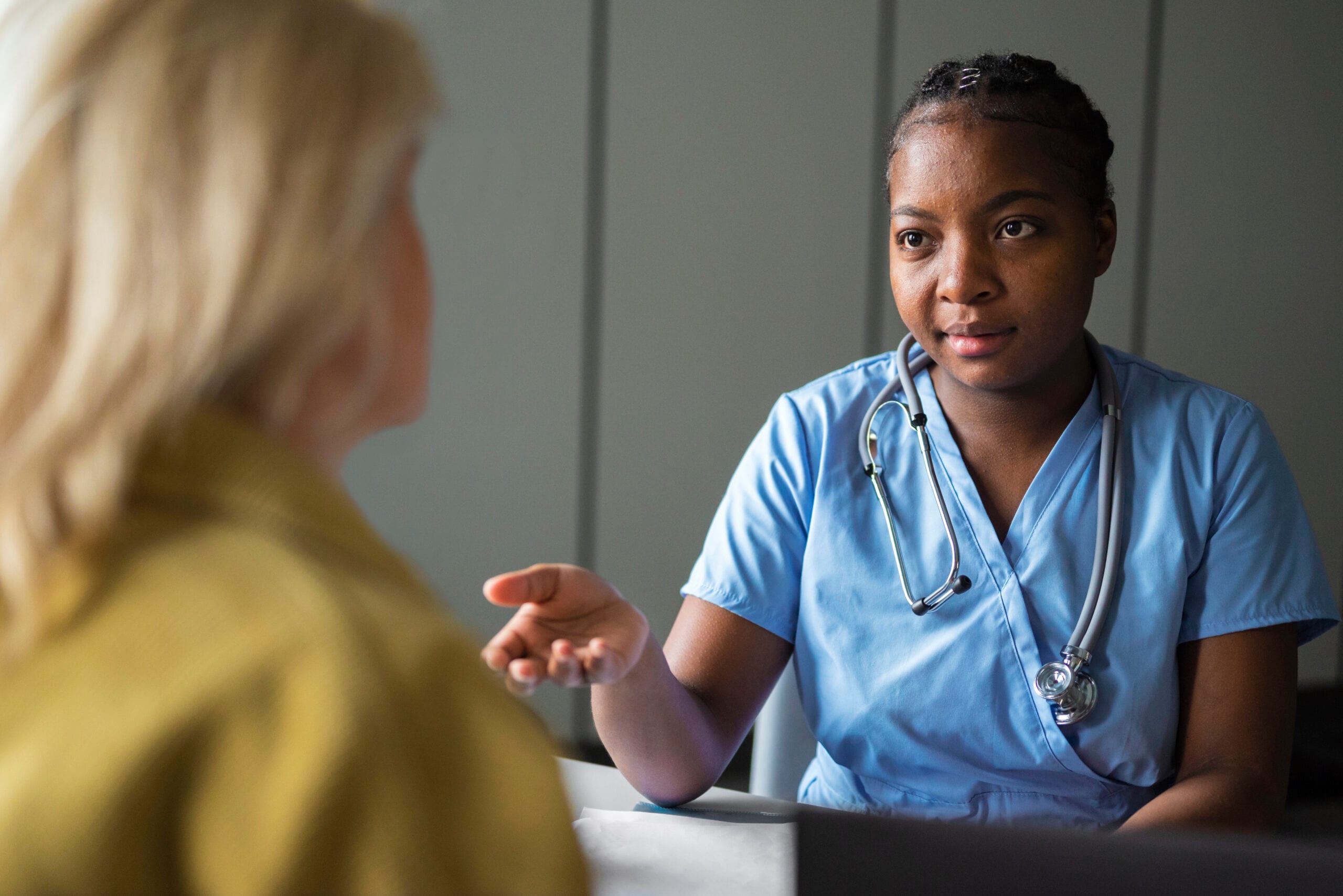 front view nurse talking patient scaled